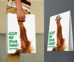 greenpeace guerilla hand reaching up shopping bag
