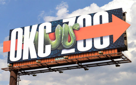 snake crawling across billboard - okc zoo