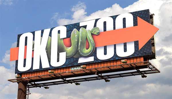 snake crawling across billboard - okc zoo
