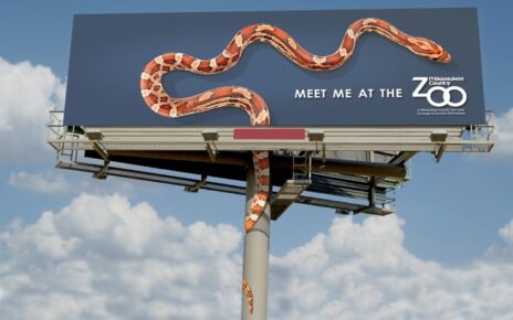 snake climibing billboard milwaukee zoon